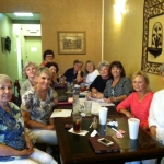 The ladies of LLC Book Club (Covington, Louisiana) happily discuss the fun twists and surprises in