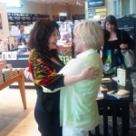 Barnes & Nobles, Washington, DC, Karen Kondazian and a friend embrace, June 18, 2012