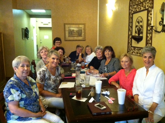 The ladies of LLC Book Club (Covington, Louisiana) happily discuss the fun twists and surprises in 
