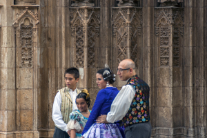 Family in tradtional Spanish attire posing by the Valencia Cathedral - Valencia, Spain