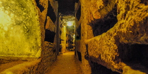 A winding maze of tunnels inside the Catacombs of Callixtus - Rome, Italy.